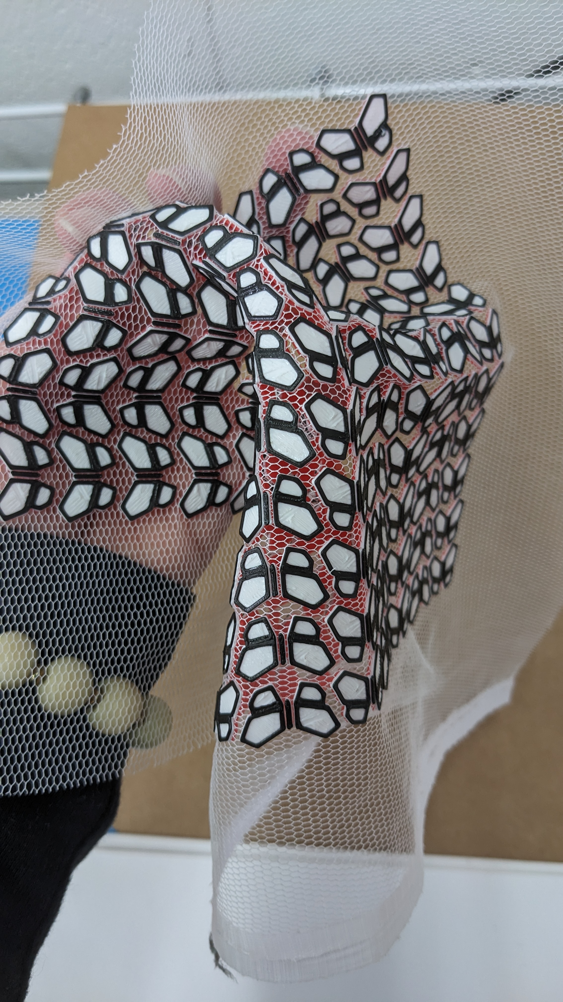 3D printing interrupted with layers of fabric