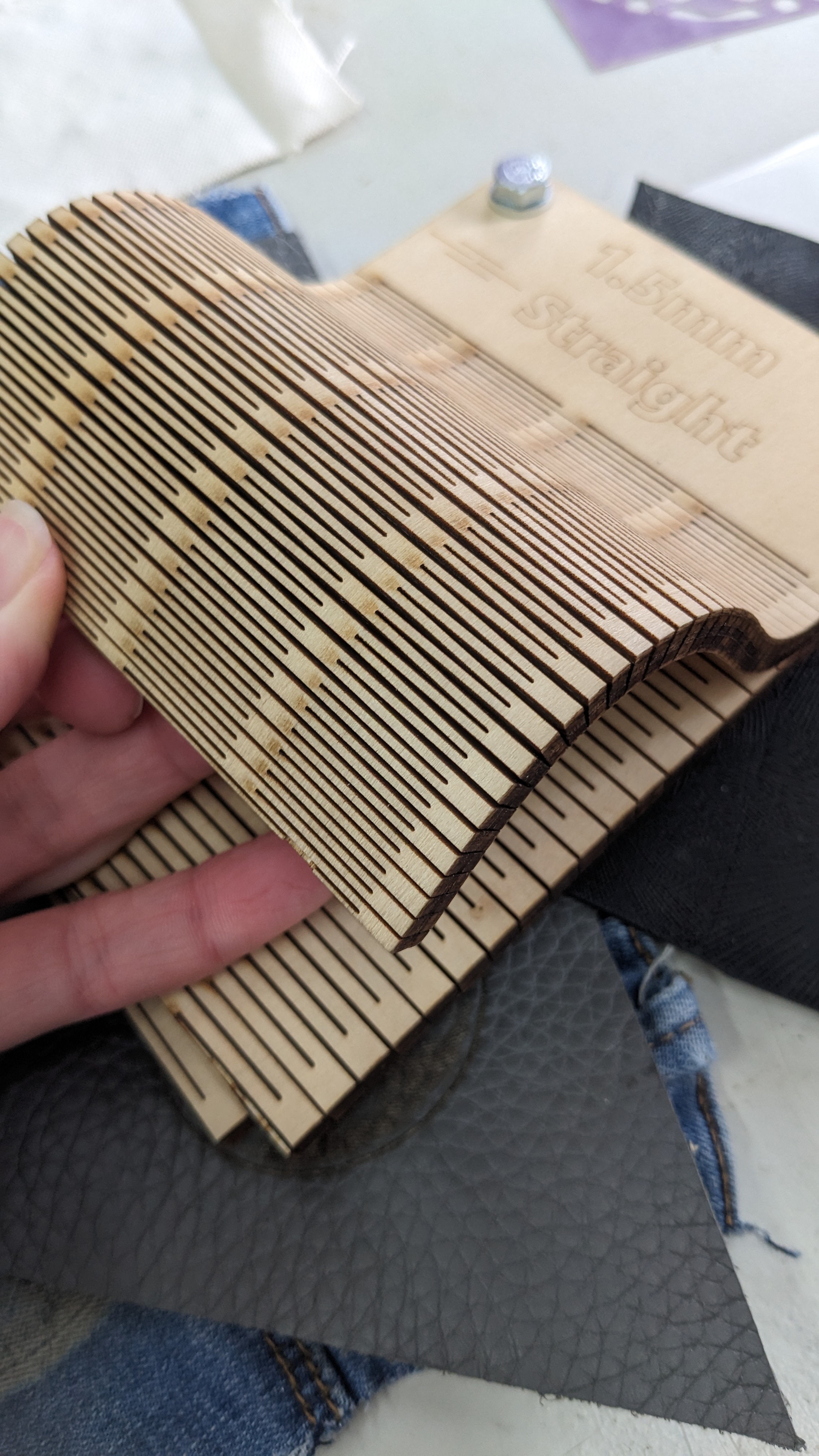 Ply etched with a repeated pattern that alters the end material into a flexible fabric