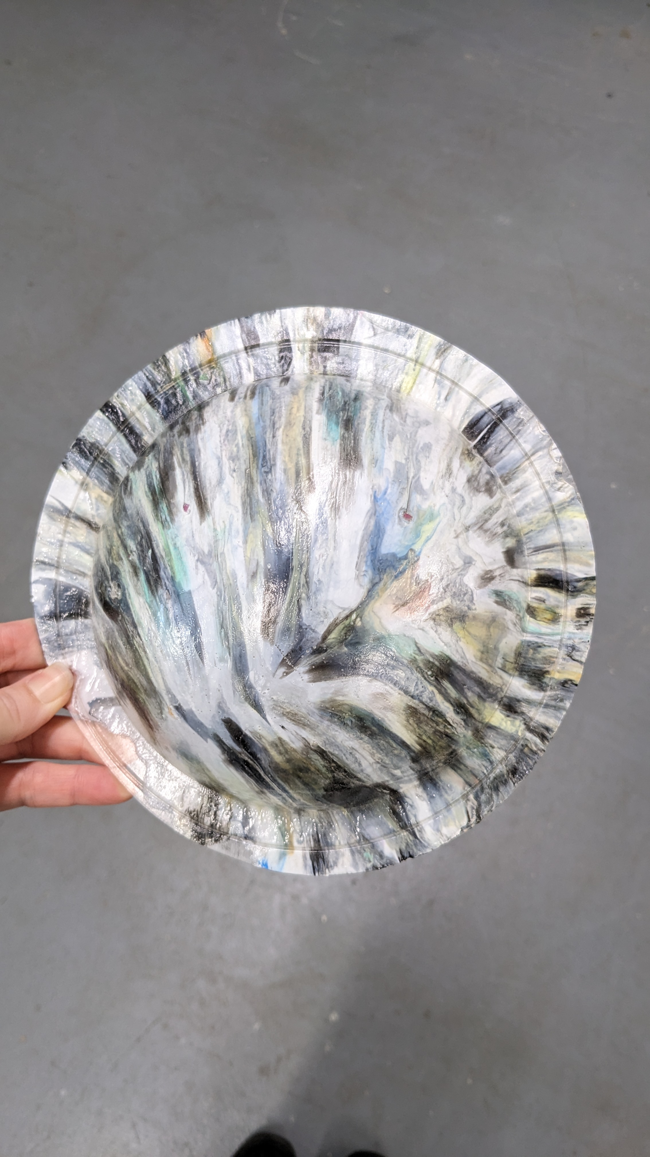 Recycled plastic heated and put into a domed mould