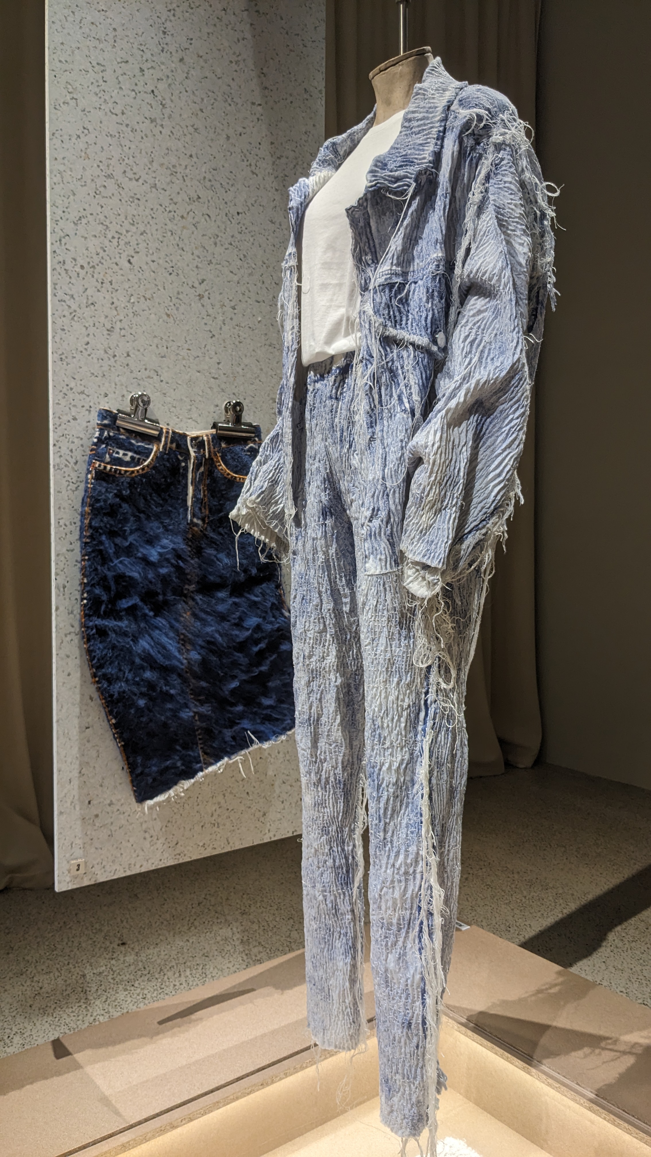 Denim yarns woven into new garments.