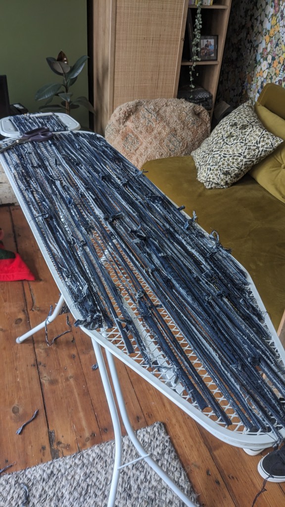 Using an ironing board to create a loom for my gendered items project